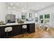 Eat-in kitchen area and stainless steel appliances and fixtures in a modern design at 1129 Victory Sw Dr, Atlanta, GA 30310