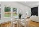 Bright eat-in kitchen area with modern furniture and fixtures and great view of the back yard at 1129 Victory Sw Dr, Atlanta, GA 30310