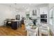 Open floor plan kitchen featuring a dark kitchen island, stainless appliances, and eat-in area at 1129 Victory Sw Dr, Atlanta, GA 30310