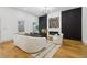 Bright living room with modern decor, fireplace, hardwood floors and stylish furniture at 1129 Victory Sw Dr, Atlanta, GA 30310