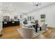 Open-concept layout with modern kitchen, hardwood floors and stylish furniture at 1129 Victory Sw Dr, Atlanta, GA 30310