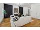 Stylish living room with a modern fireplace, statement lighting, and chic decor at 1129 Victory Sw Dr, Atlanta, GA 30310
