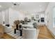 Spacious living room with hardwood floors, stylish furniture, and modern lighting at 1129 Victory Sw Dr, Atlanta, GA 30310