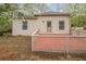 Back exterior of a one-story home featuring a back deck and neutral siding at 134 N Alexander St, Buford, GA 30518