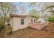 Back exterior of a one-story home featuring a back deck and neutral siding at 134 N Alexander St, Buford, GA 30518