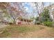 Exterior view of a one-story home with a large front yard at 134 N Alexander St, Buford, GA 30518