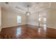 Bright living room features hardwood floors, recessed lighting, trey ceilings, and large windows with natural light at 134 N Alexander St, Buford, GA 30518