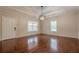 Open living room featuring hardwood floors, recessed lighting, large windows with natural light, and neutral paint at 134 N Alexander St, Buford, GA 30518