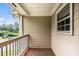 View of the exterior featuring a wood decked balcony and neutral siding at 2996 Jonesboro Road Southeast Se Rd # J, Atlanta, GA 30354