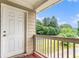 Outdoor balcony with wood railing and view of green landscaping at 2996 Jonesboro Road Southeast Se Rd # J, Atlanta, GA 30354