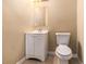 Cozy half bathroom with vanity and standard toilet at 2996 Jonesboro Road Southeast Se Rd # J, Atlanta, GA 30354