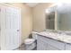 This is a bathroom with granite countertop, white cabinets, and a toilet at 2996 Jonesboro Road Southeast Se Rd # J, Atlanta, GA 30354