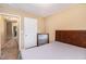 This bedroom features neutral walls, a bed with patterned bedding, and a mirror at 2996 Jonesboro Road Southeast Se Rd # J, Atlanta, GA 30354