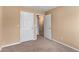 This is a bedroom with neutral walls, carpet, and white doors at 2996 Jonesboro Road Southeast Se Rd # J, Atlanta, GA 30354