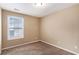 This is a carpeted bedroom with neutral walls and a window for natural light at 2996 Jonesboro Road Southeast Se Rd # J, Atlanta, GA 30354