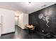 Dining space featuring a chalkboard wall with table, chairs, and black wood floors at 2996 Jonesboro Road Southeast Se Rd # J, Atlanta, GA 30354