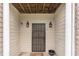 Covered entryway featuring a secure metal gate and decorative sconce lighting at 2996 Jonesboro Road Southeast Se Rd # J, Atlanta, GA 30354