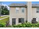 Exterior view of the home, featuring a fenced backyard and an A/C unit at 2996 Jonesboro Road Southeast Se Rd # J, Atlanta, GA 30354