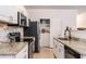 Well-equipped kitchen with granite countertops, stainless steel appliances, and pantry at 2996 Jonesboro Road Southeast Se Rd # J, Atlanta, GA 30354