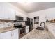 Kitchen features granite countertops, stainless steel appliances, and ample cabinet space at 2996 Jonesboro Road Southeast Se Rd # J, Atlanta, GA 30354