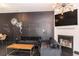 Stylish living room with a chalkboard wall, fireplace, and modern light fixture at 2996 Jonesboro Road Southeast Se Rd # J, Atlanta, GA 30354