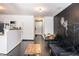 Open living area with dark wood flooring, chalkboard wall, and dining table at 2996 Jonesboro Road Southeast Se Rd # J, Atlanta, GA 30354