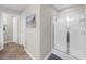 Well-lit bathroom features a tiled shower with glass door and a view to the other rooms at 3504 Castleberry Village Cir # 36, Cumming, GA 30040