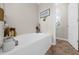 Relaxing bathroom with a large soaking tub, neutral paint, and a bright window view at 3504 Castleberry Village Cir # 36, Cumming, GA 30040