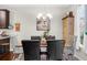 Inviting dining room featuring a wooden table, stylish chandelier, and comfortable seating for Gathering meals at 3504 Castleberry Village Cir # 36, Cumming, GA 30040