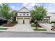 Charming townhouse featuring a two-car garage and well-maintained landscaping at 3504 Castleberry Village Cir # 36, Cumming, GA 30040
