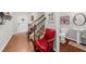 Inviting foyer with hardwood floors, a staircase, and a powder room featuring a pedestal sink at 3504 Castleberry Village Cir # 36, Cumming, GA 30040