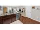 Kitchen with stainless steel dishwasher and sink plus hardwood floors and plenty of cabinet space at 3504 Castleberry Village Cir # 36, Cumming, GA 30040