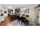 Open concept kitchen featuring granite countertops, stainless steel appliances, and adjacent dining area at 3504 Castleberry Village Cir # 36, Cumming, GA 30040