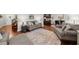 Open-concept living room with hardwood floors, ample seating, and a seamless flow to the dining area at 3504 Castleberry Village Cir # 36, Cumming, GA 30040