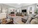 Spacious living room with hardwood floors, comfortable seating, and an open layout to the dining area at 3504 Castleberry Village Cir # 36, Cumming, GA 30040