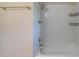 This bathroom showcases a tiled shower-tub combination and towel rack at 4457 Lincoln Jones Rd, Ellenwood, GA 30294