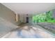 Covered carport featuring a painted brick wall, providing shelter and parking space at 4457 Lincoln Jones Rd, Ellenwood, GA 30294