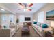 Cozy living room with stylish furniture, plush carpeting and large windows at 4457 Lincoln Jones Rd, Ellenwood, GA 30294