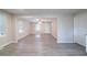 Bright living area with neutral paint, large windows, ceiling fan, and open floor plan at 4457 Lincoln Jones Rd, Ellenwood, GA 30294