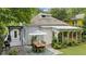 Charming backyard featuring a dining area, deck, sunroom, and lush landscaping at 797 Ashland Ne Ave, Atlanta, GA 30307