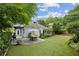 Beautiful backyard with a dining area, covered porch, and professionally landscaped yard at 797 Ashland Ne Ave, Atlanta, GA 30307