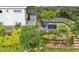 Secluded backyard features lush landscaping, a custom seating area with fire pit, and a shed with deck at 797 Ashland Ne Ave, Atlanta, GA 30307
