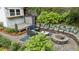 Picturesque backyard featuring a fire pit, custom bench seating, and a shed with a bar top counter at 797 Ashland Ne Ave, Atlanta, GA 30307