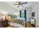 Charming bedroom with colorful bedding, hardwood floors, and a bright window with decorative curtains at 797 Ashland Ne Ave, Atlanta, GA 30307