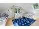 Charming bedroom with two twin beds, skylight, and a large window providing ample natural light at 797 Ashland Ne Ave, Atlanta, GA 30307