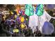 A large group of people walking on the BeltLine at night with glowing lanterns and festive decorations at 797 Ashland Ne Ave, Atlanta, GA 30307