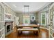 Bright dining room featuring wallpaper, hardwood floors, a fireplace, and ample natural light at 797 Ashland Ne Ave, Atlanta, GA 30307