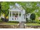 Charming craftsman home featuring a covered front porch, red door, and landscaped front yard at 797 Ashland Ne Ave, Atlanta, GA 30307