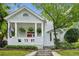 Charming home featuring a covered front porch, beautiful landscaping, and a quaint, historic design at 797 Ashland Ne Ave, Atlanta, GA 30307