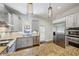 Well-equipped kitchen features stainless steel appliances, granite countertops, and stylish pendant lighting at 797 Ashland Ne Ave, Atlanta, GA 30307